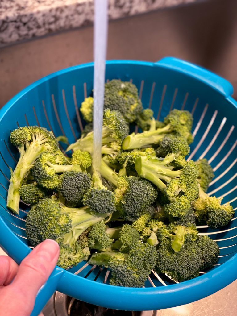 picture of rinsing broccoli for instant pot steaming