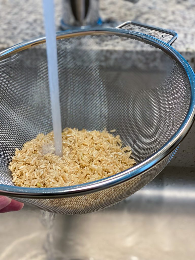 picture of rinsing brown rice