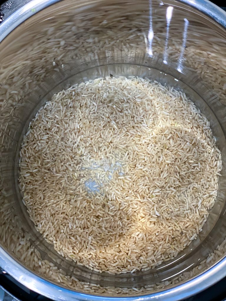 picture of brown rice and water in instant pot